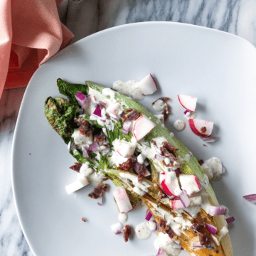 Dairy-free ranch dressing over lettuce with raddish, bacon and onions