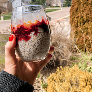 Chia seed in a glass pudding outside with berries