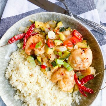 Kung Pao shrimp and veggies served over cauliflower rice