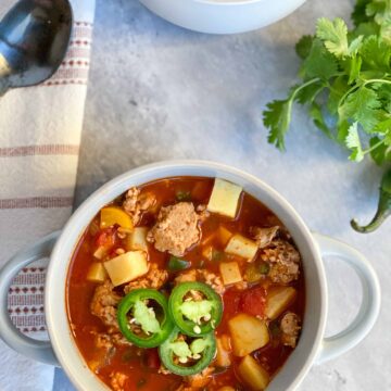 Sweet Potato Chili in a bowl with jalapenos on top