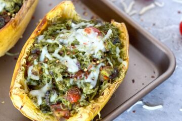 Spaghetti squash with trader joe's pesto on a pan