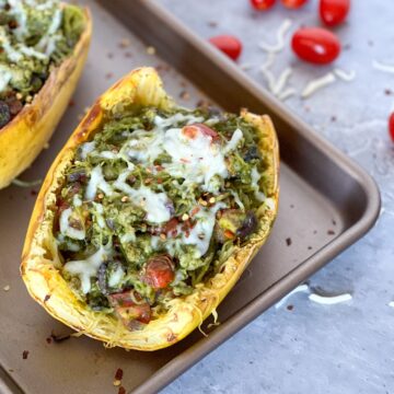 Spaghetti squash with trader joe's pesto on a pan