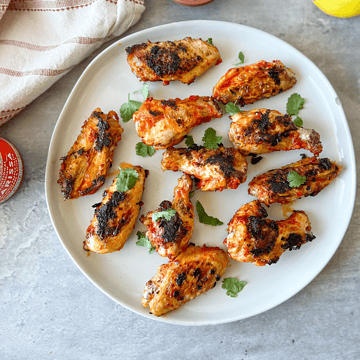 Lemon Harissa chicken wings on a plate